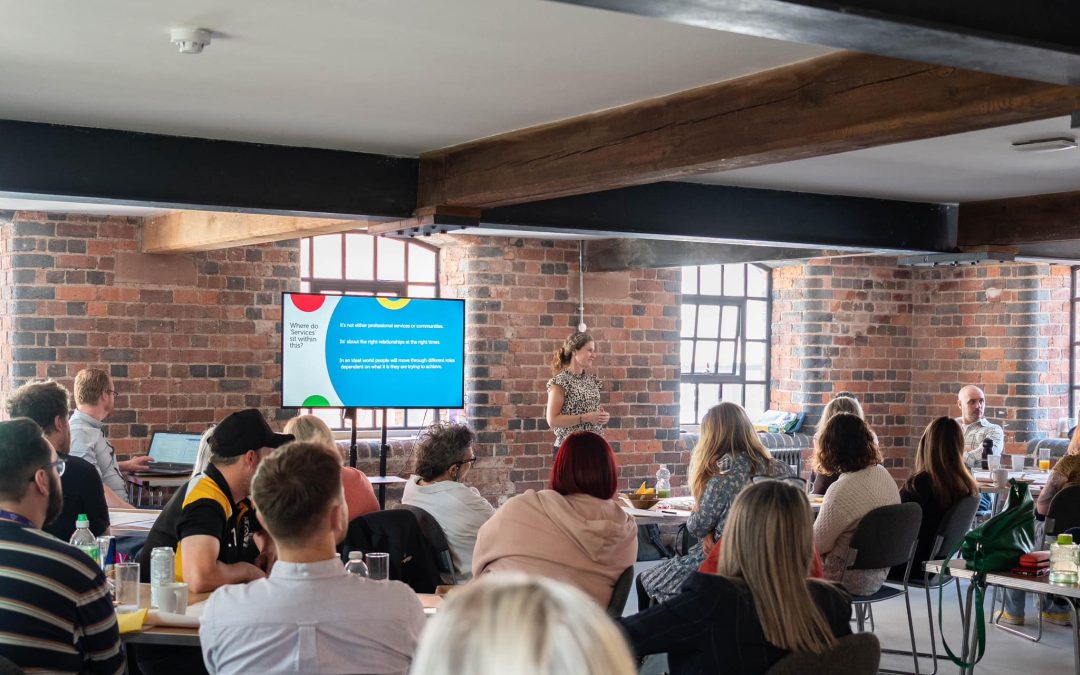 Staff at WCT discussing and sharing ideas at The Granary in Worcester